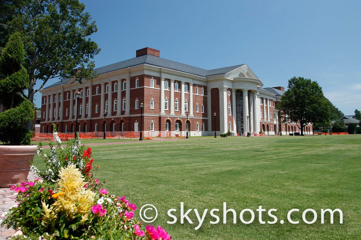 Brick building with columns and garden