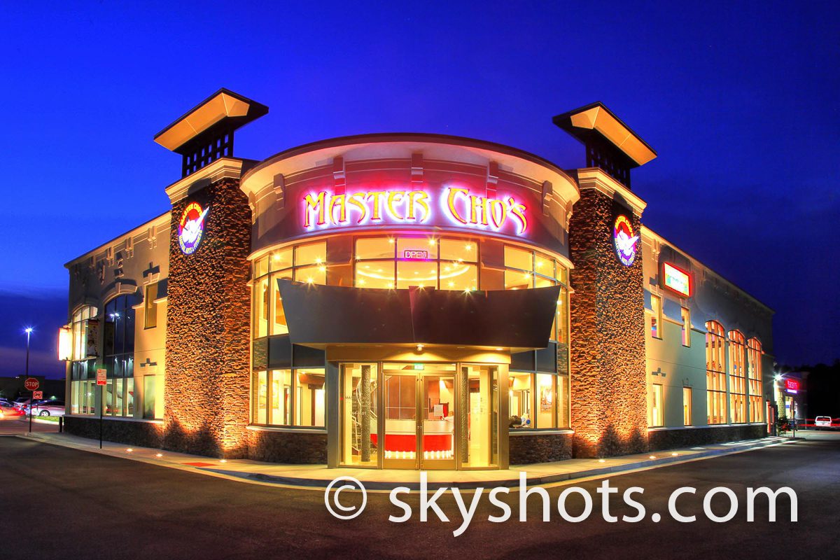 Illuminated restaurant exterior with signage