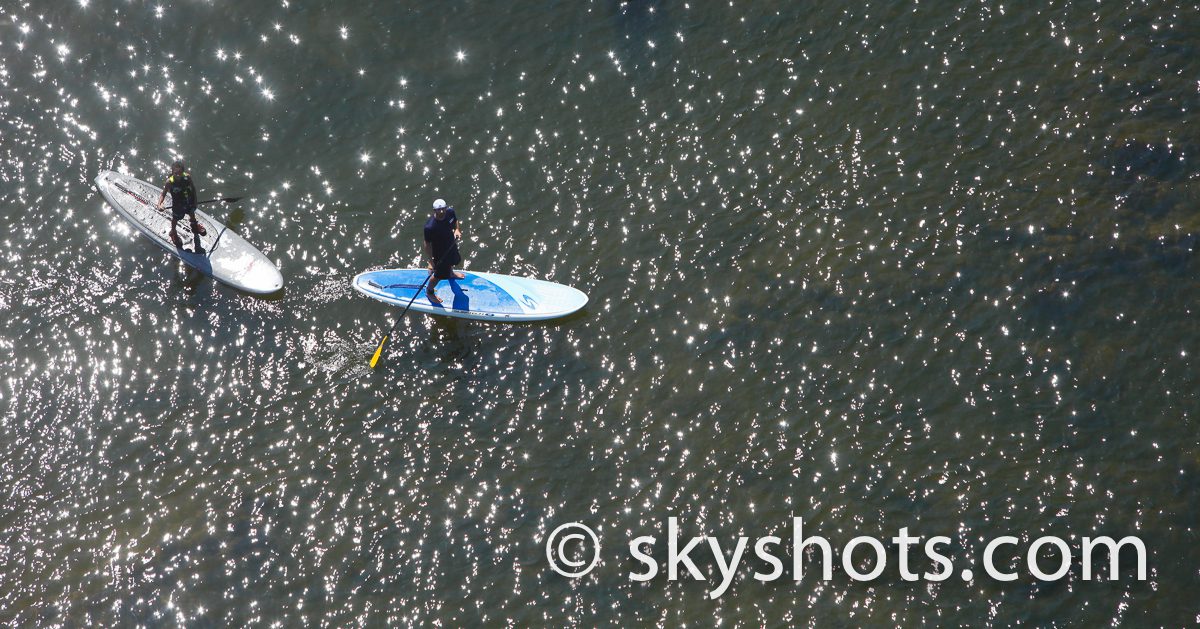 Aerial view of paddleboarding duo