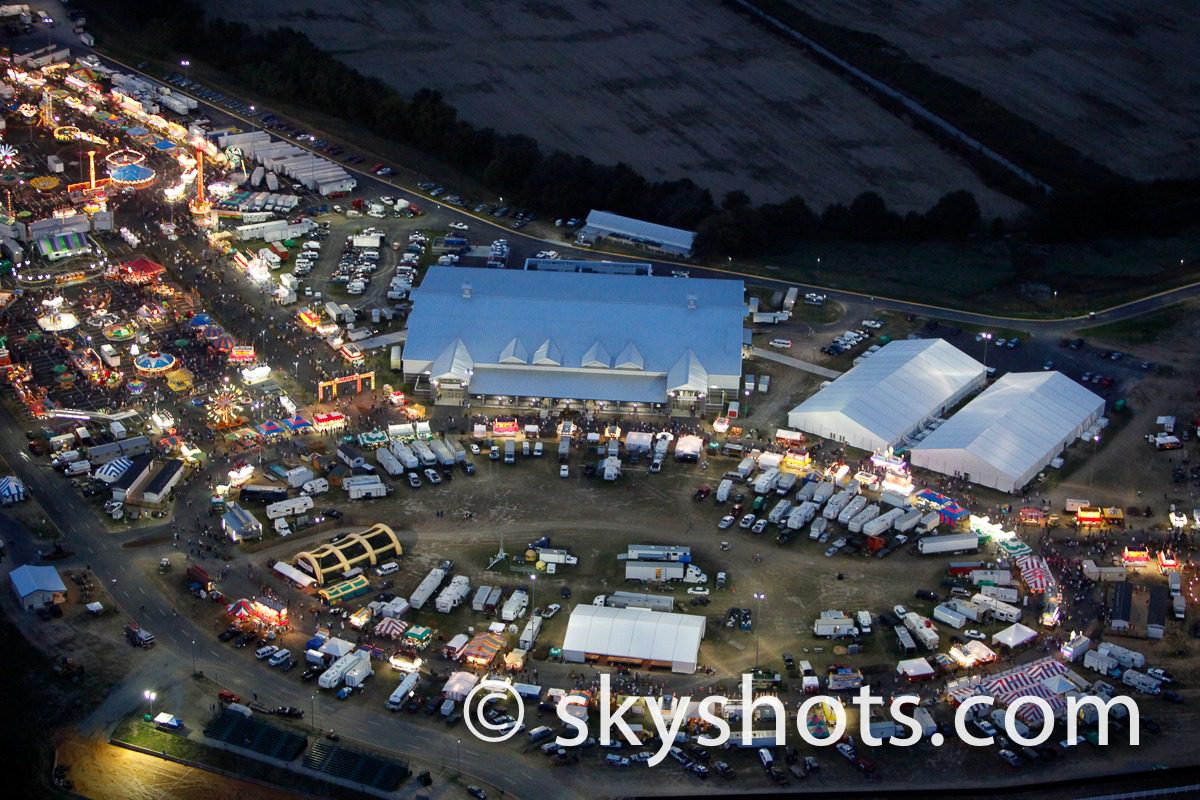 Aerial view of illuminated fairground at night