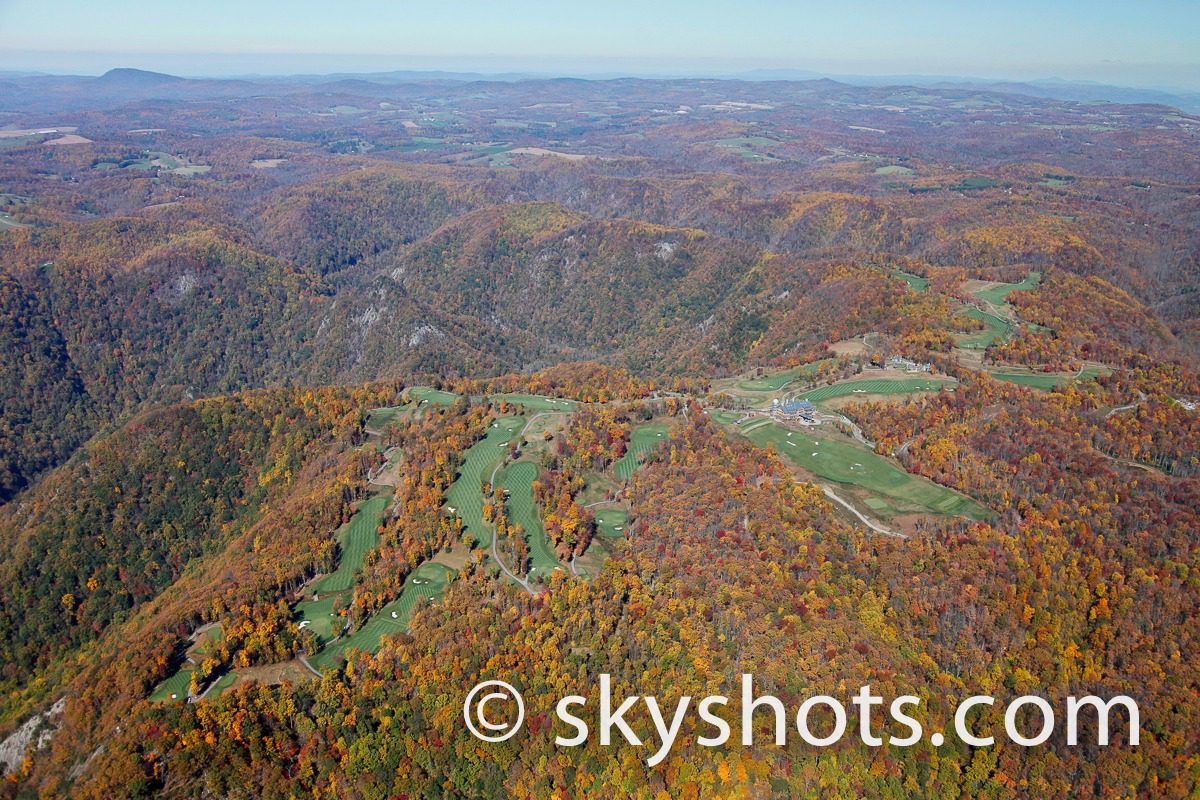 Scenic aerial of wooded hills in fall