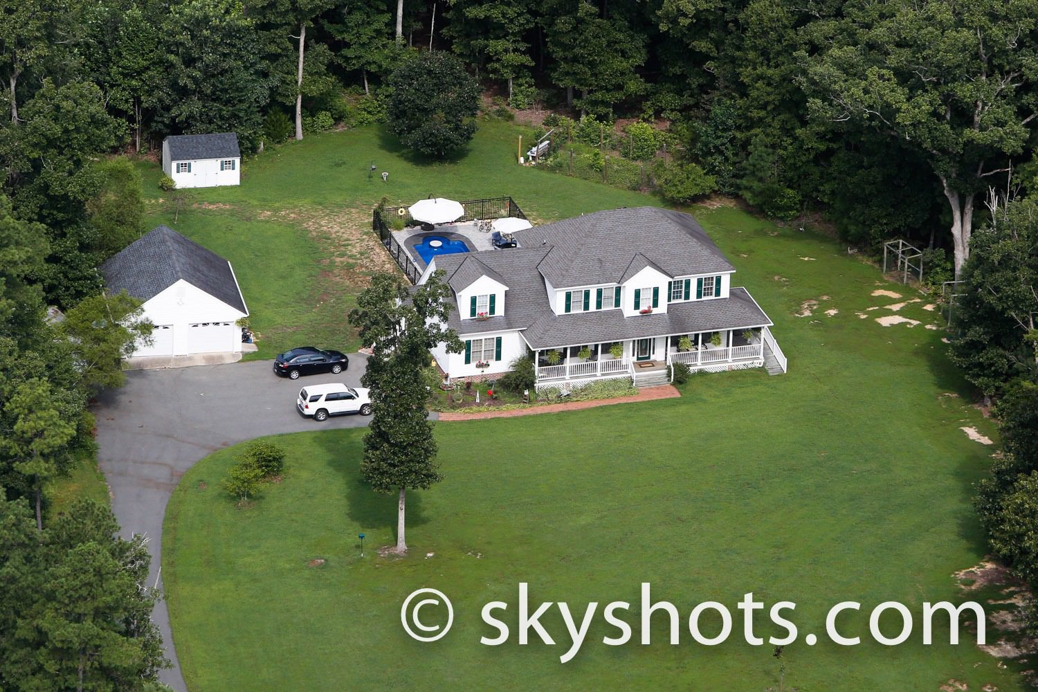 House with driveway and backyard pool