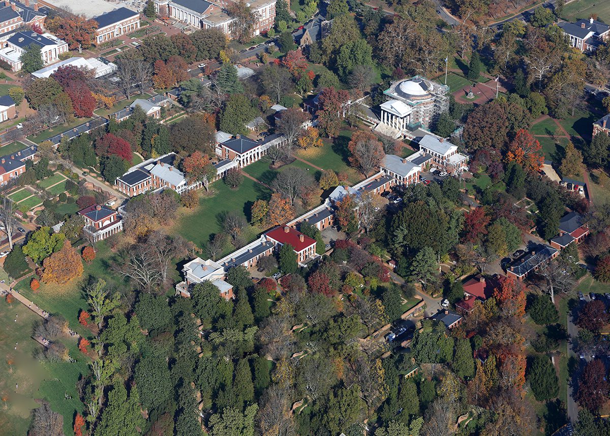 Historic college buildings surrounded by trees